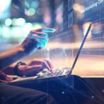 Man Using a Laptop with Business data Analytics dashboard animated overlays
